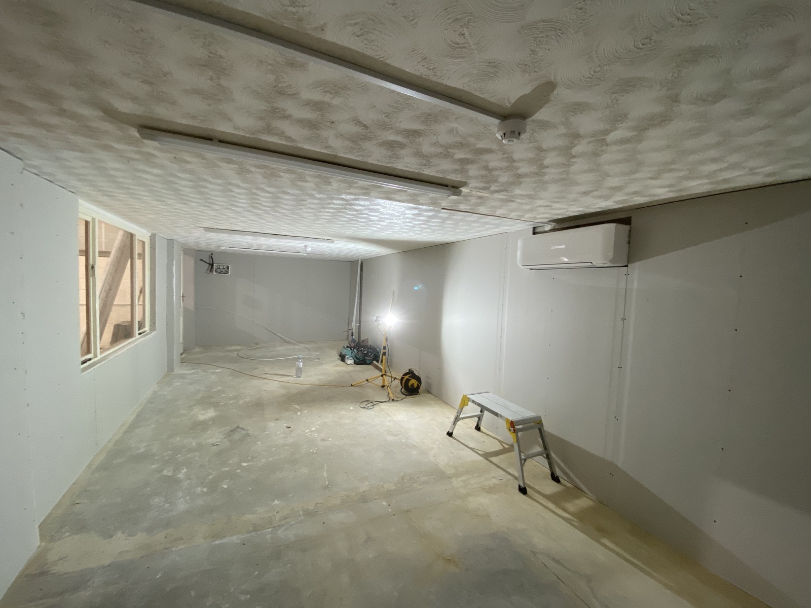 Boarded research lab room after the partition installation