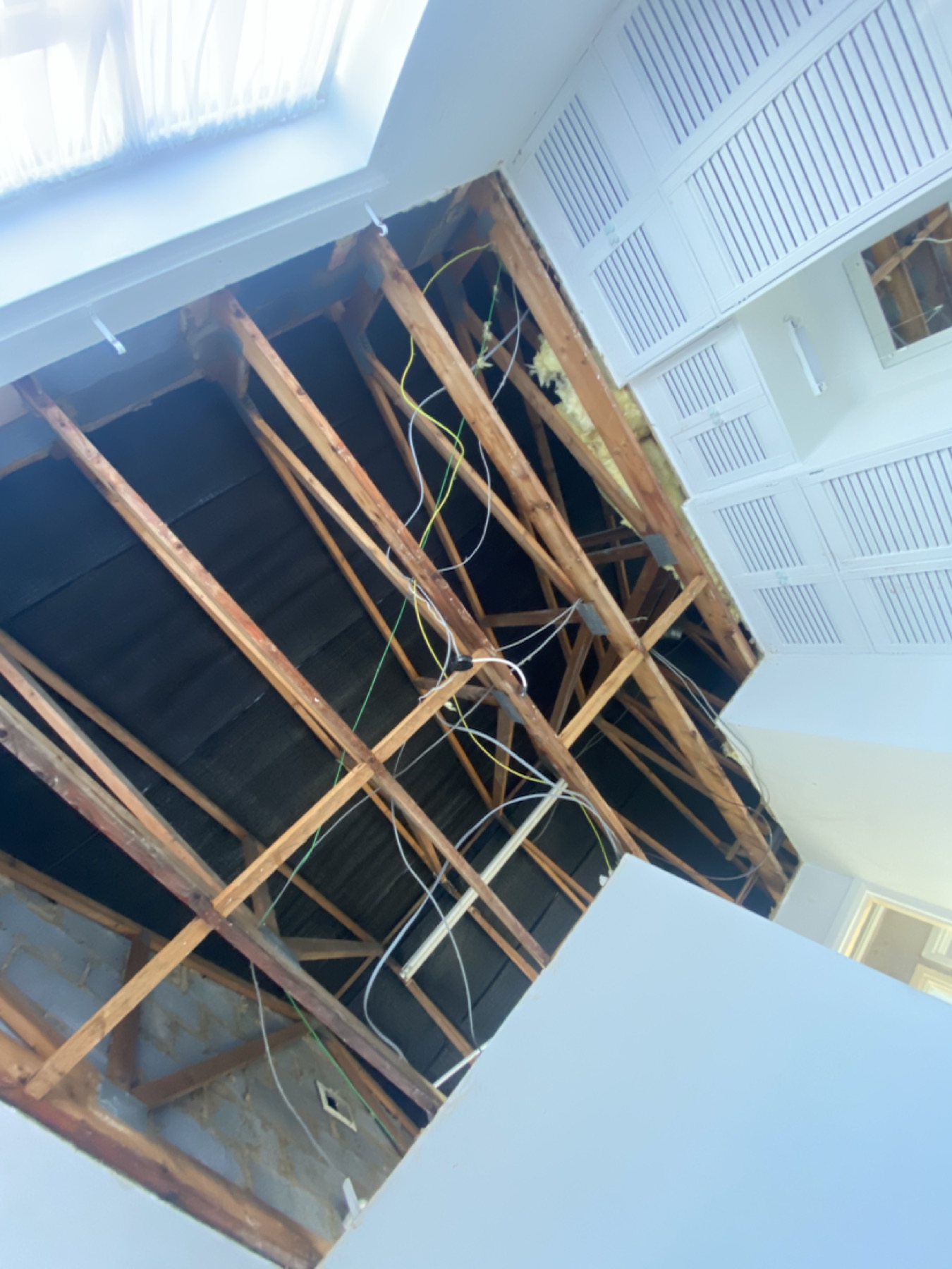 Ceiling stripped back to timber joists after water damage