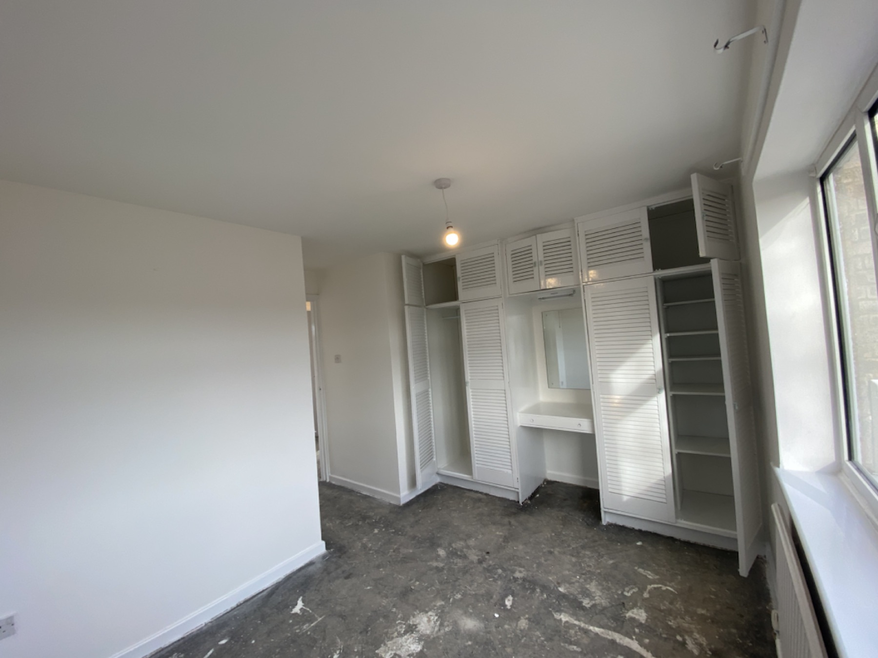 Bedroom after ceiling replacement and full redecoration