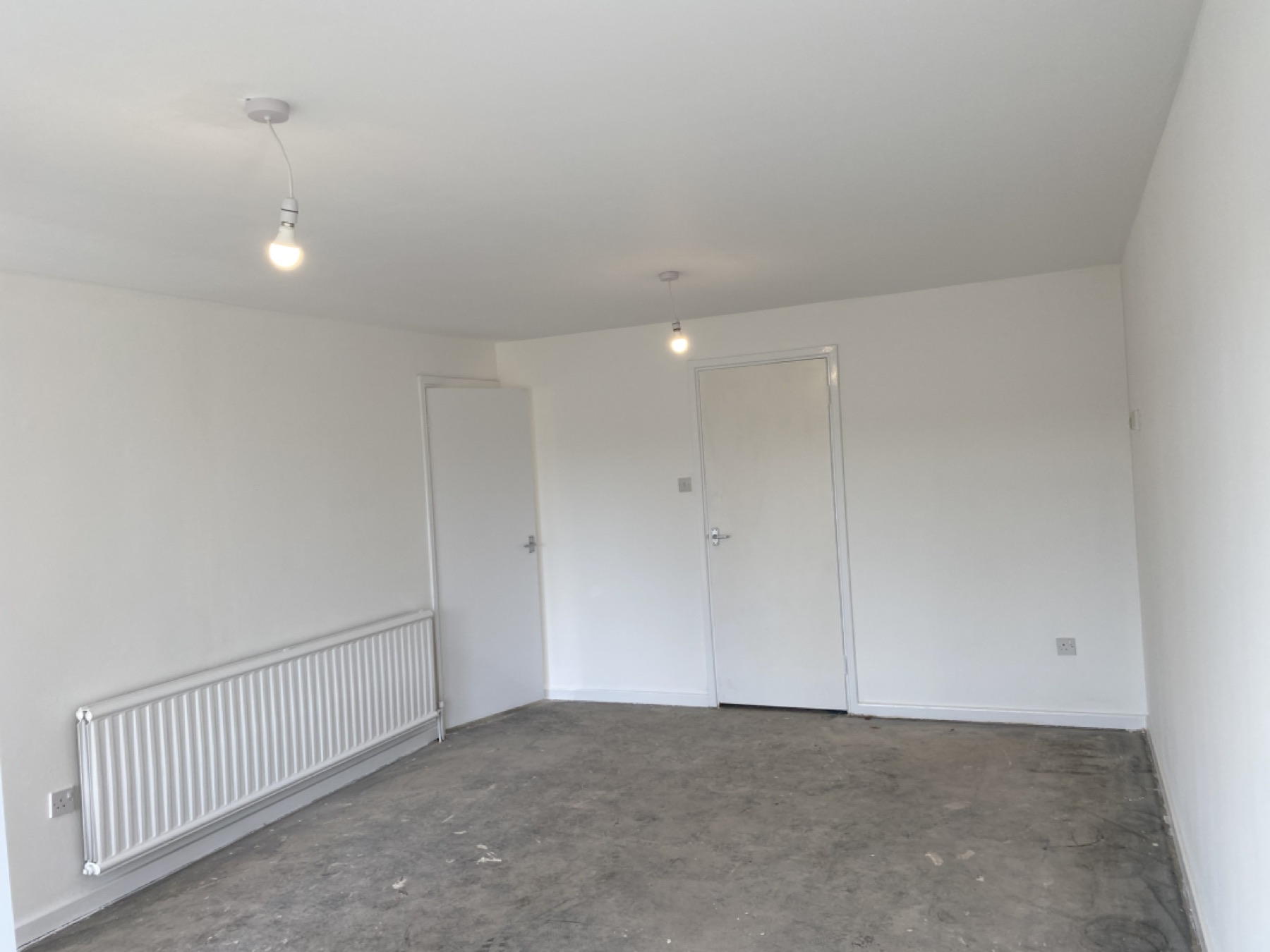 Completed living room after ceiling replacement and redecoration in Brandon