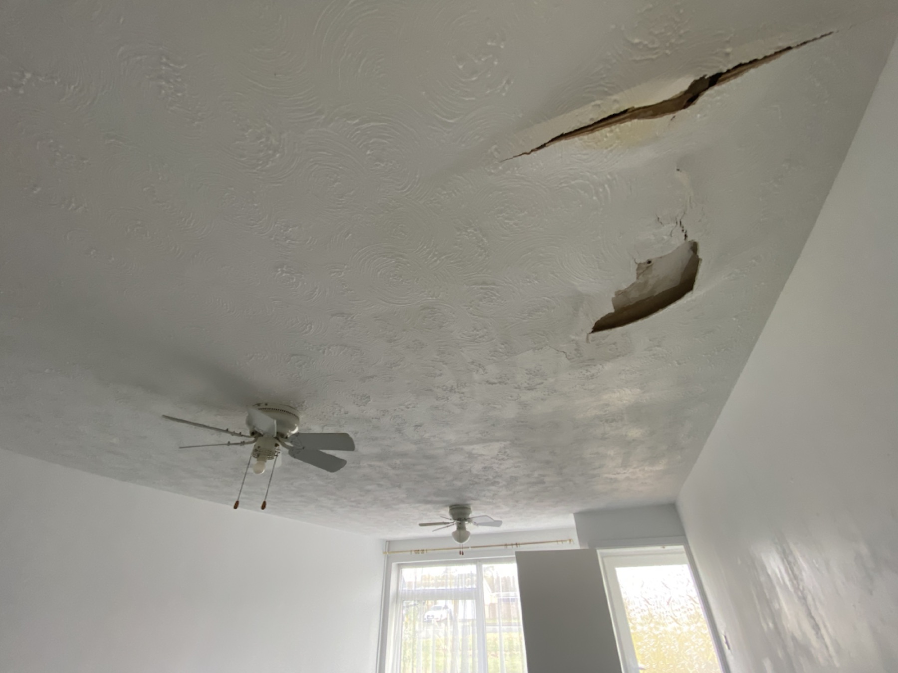 Water-damaged ceiling before removal in Brandon