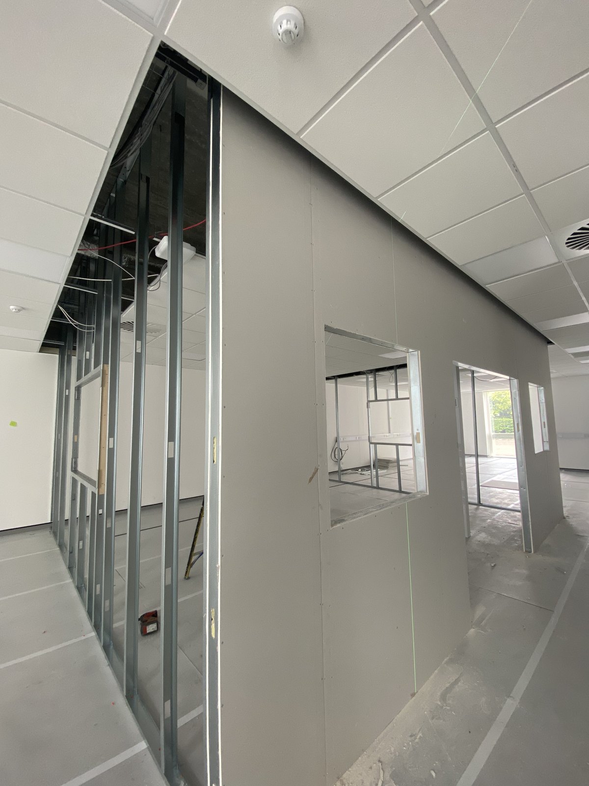 Observation openings formed in the inspection-room partition
