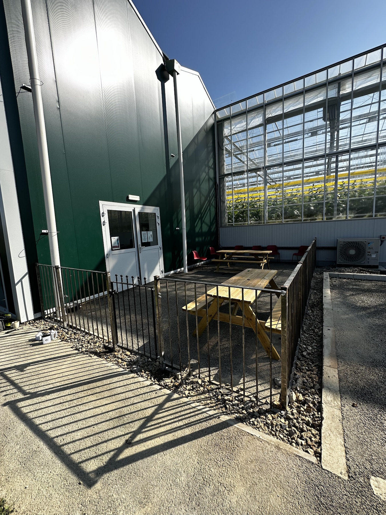 Finished iron-fenced smoking area at The Greenhouse Growers in Ely