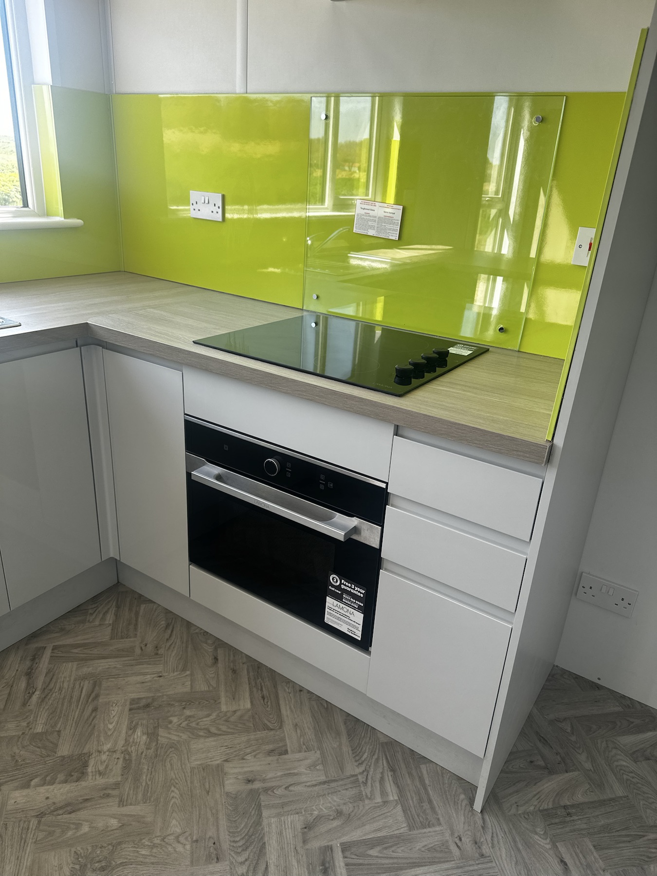 Completed kitchen appliances and electrical outlets inside the site accommodation