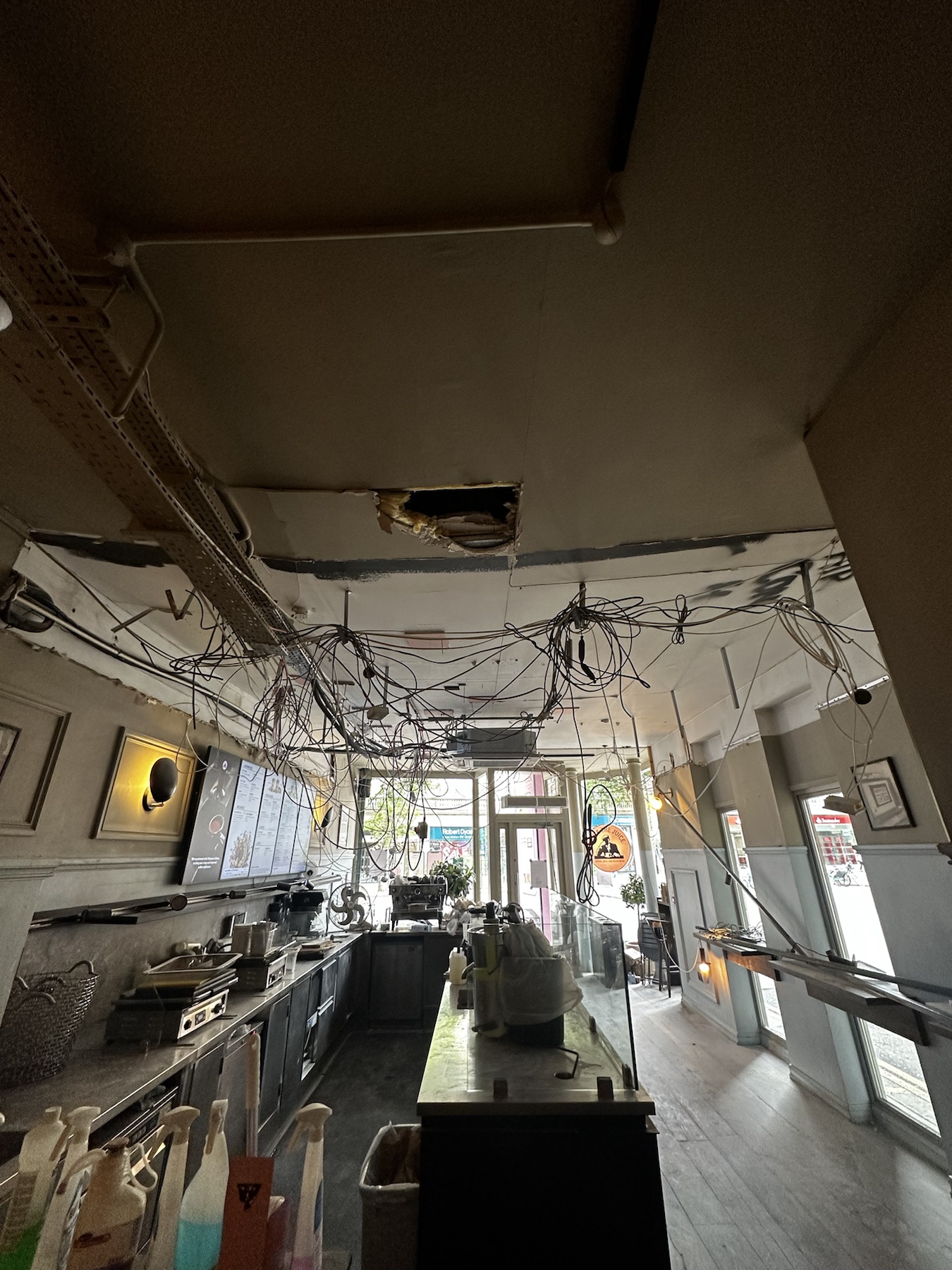 Existing cables and ceiling services exposed during remedial works