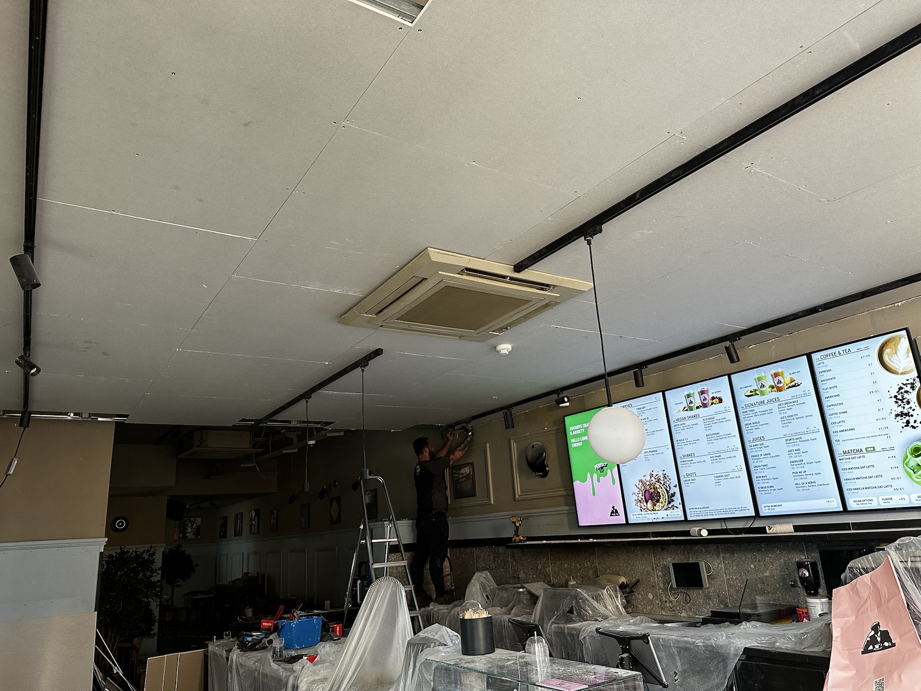 Replacement MF bulkhead ceiling boarded at Joe and The Juice in Kensington
