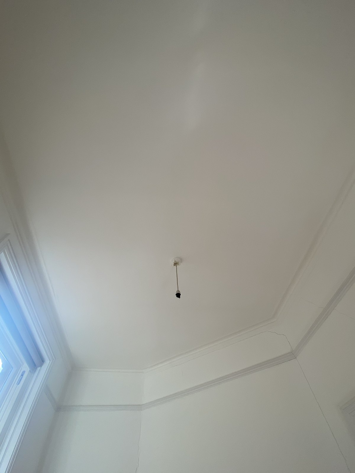 Finished painted ceiling with retained cornice in the Maida Vale flat