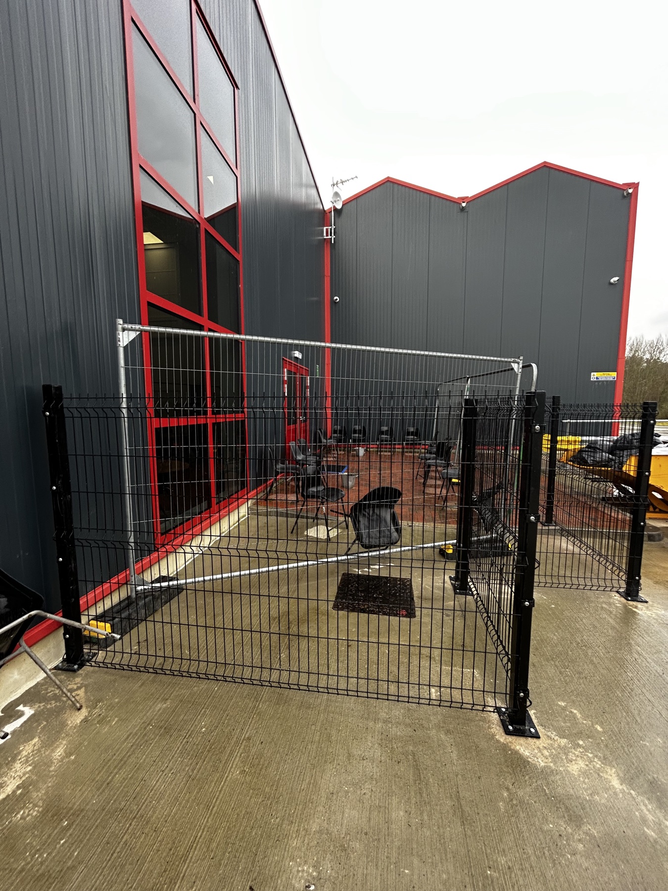 Second fenced designated smoking area at the commercial site