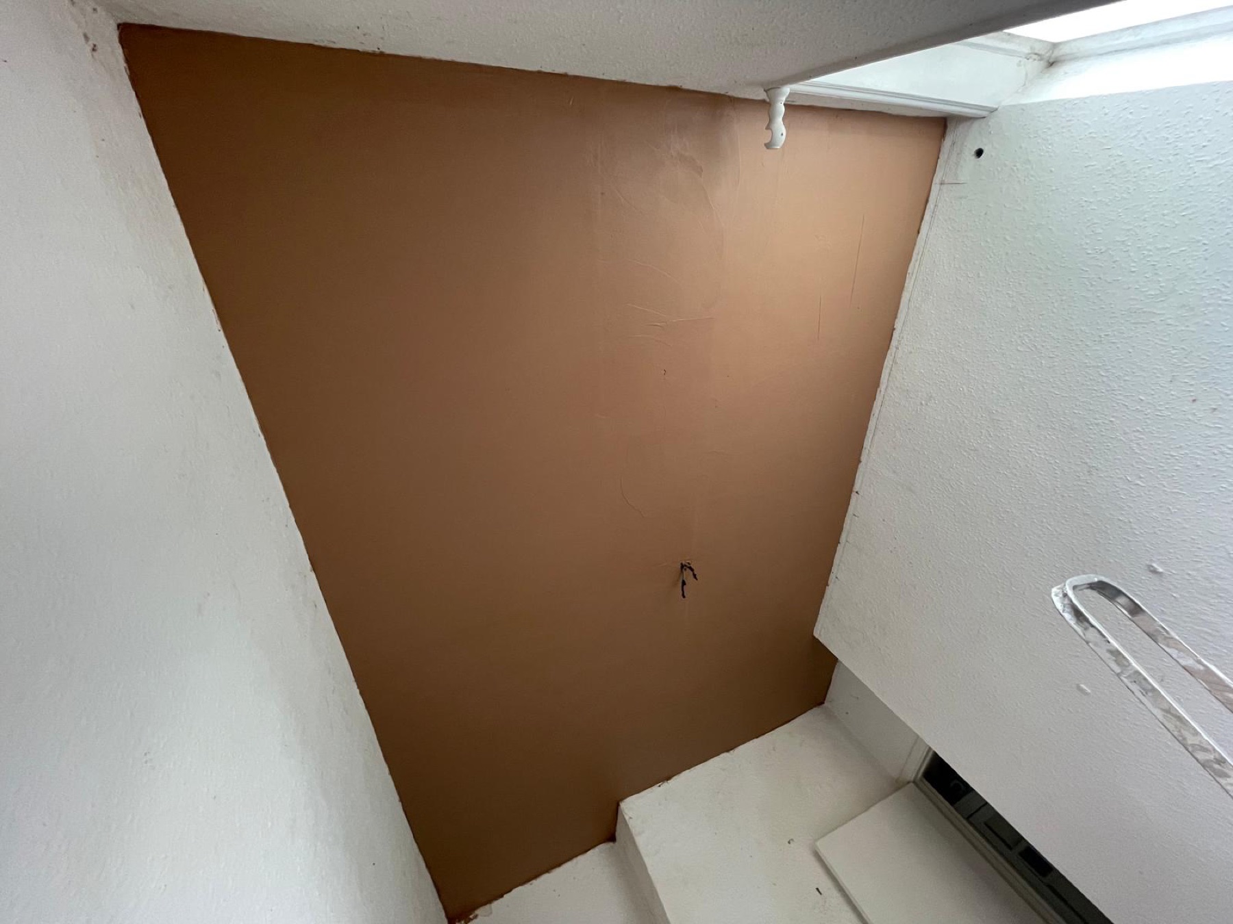 Freshly plastered acoustic ceiling drying in the Sudbury flat