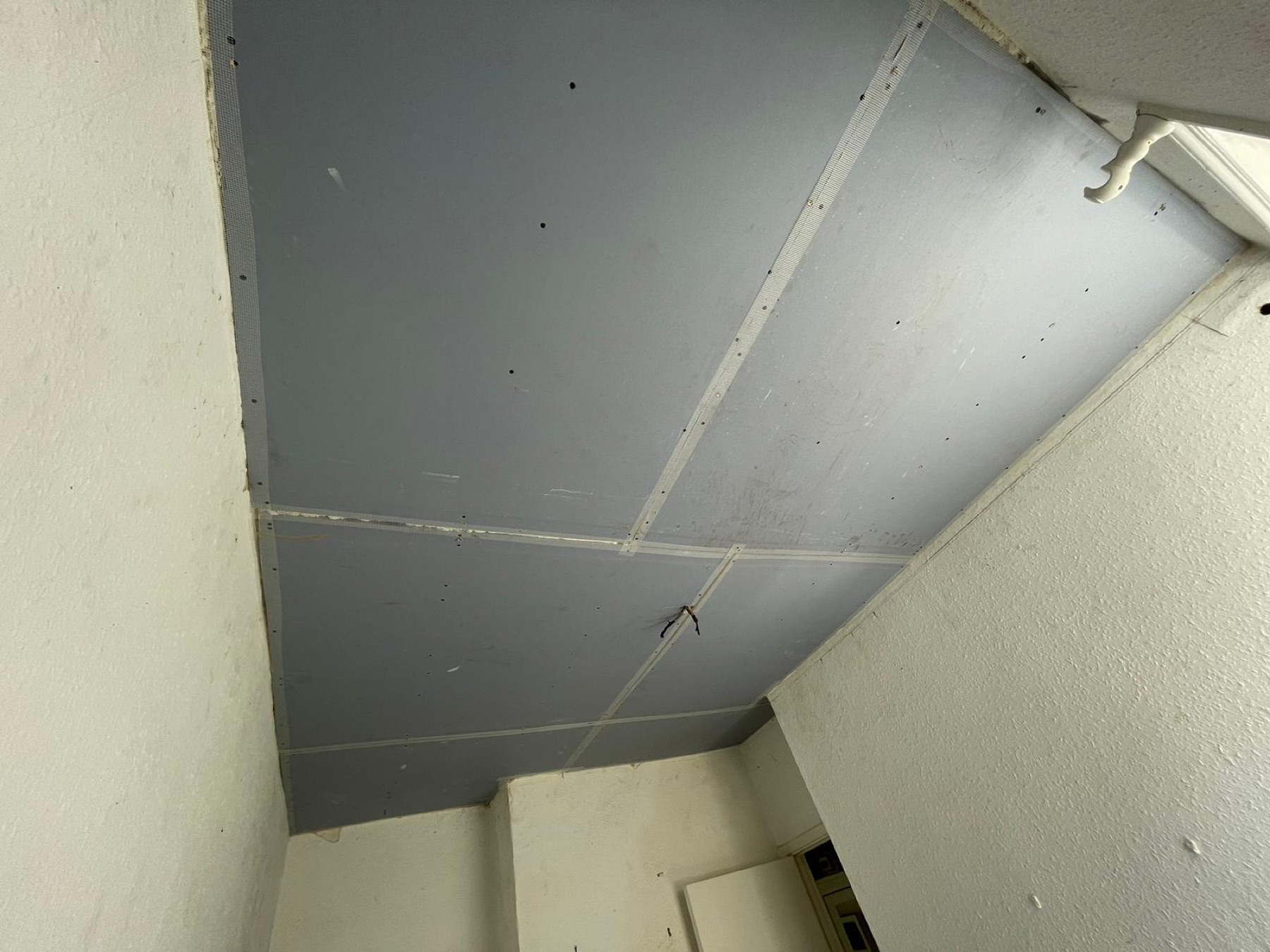 SoundBloc acoustic plasterboard installed to the resilient-bar ceiling system