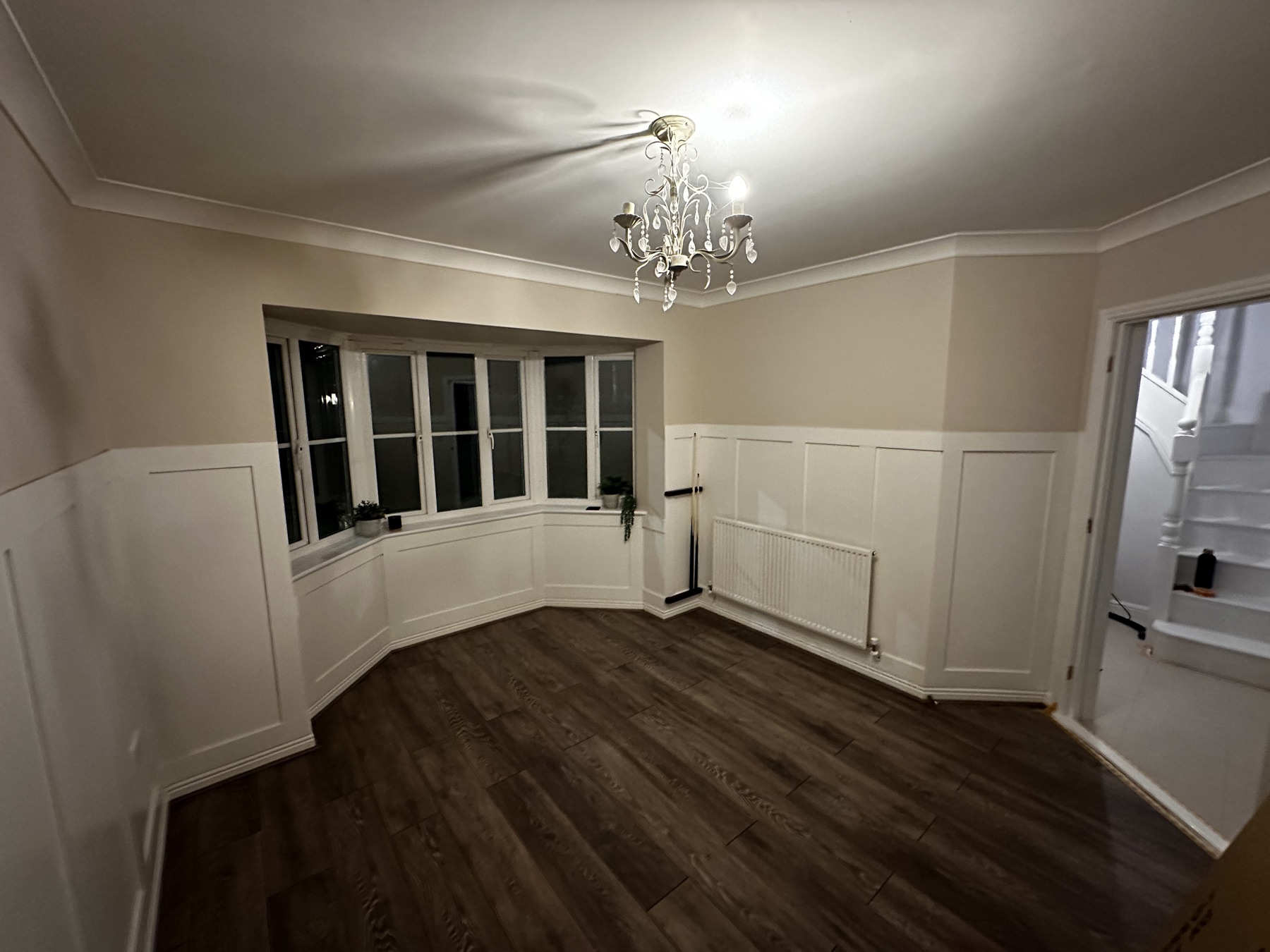 Finished games room with decorative panelling and new flooring