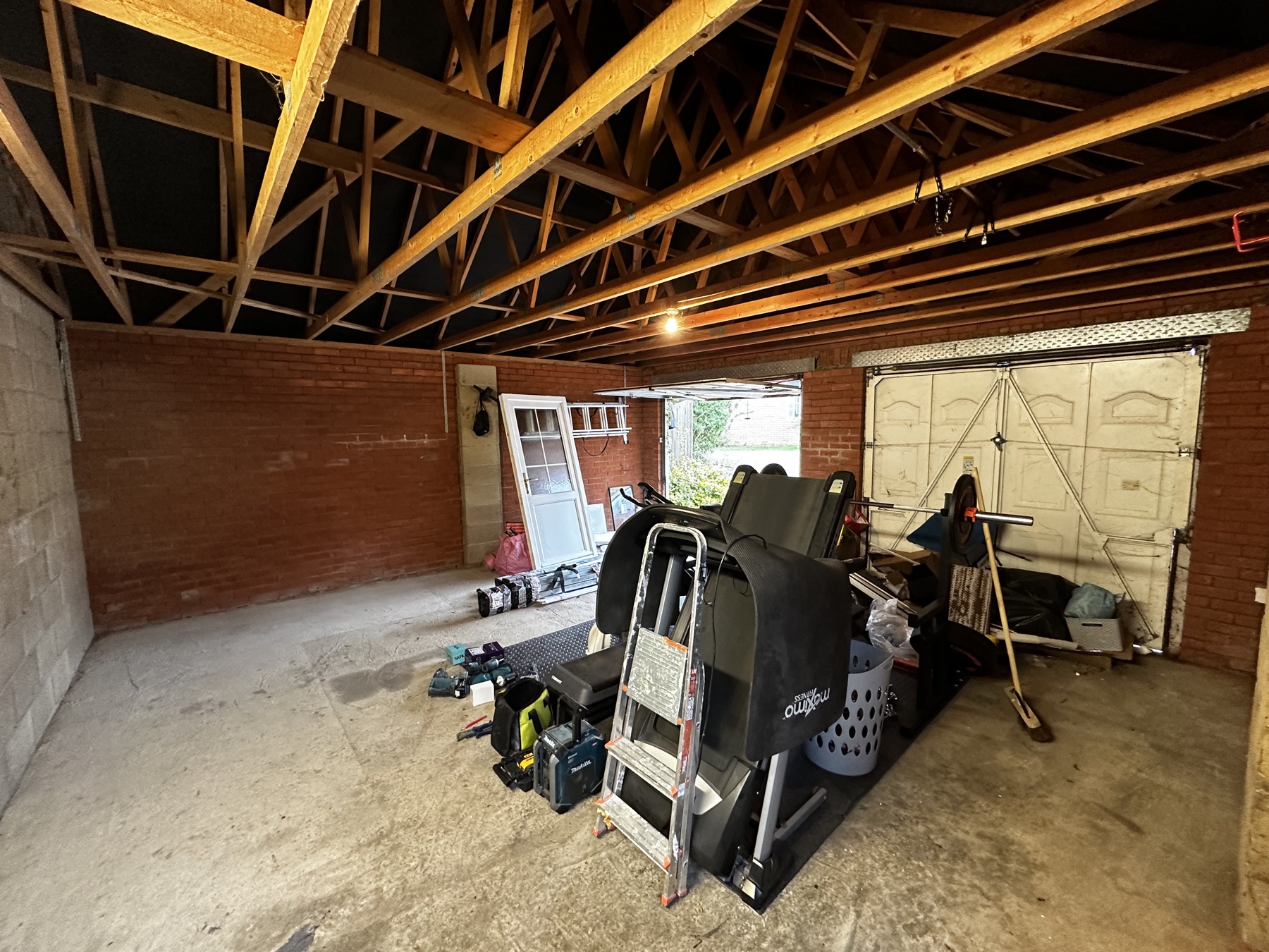 Bare double garage before conversion into a home gym