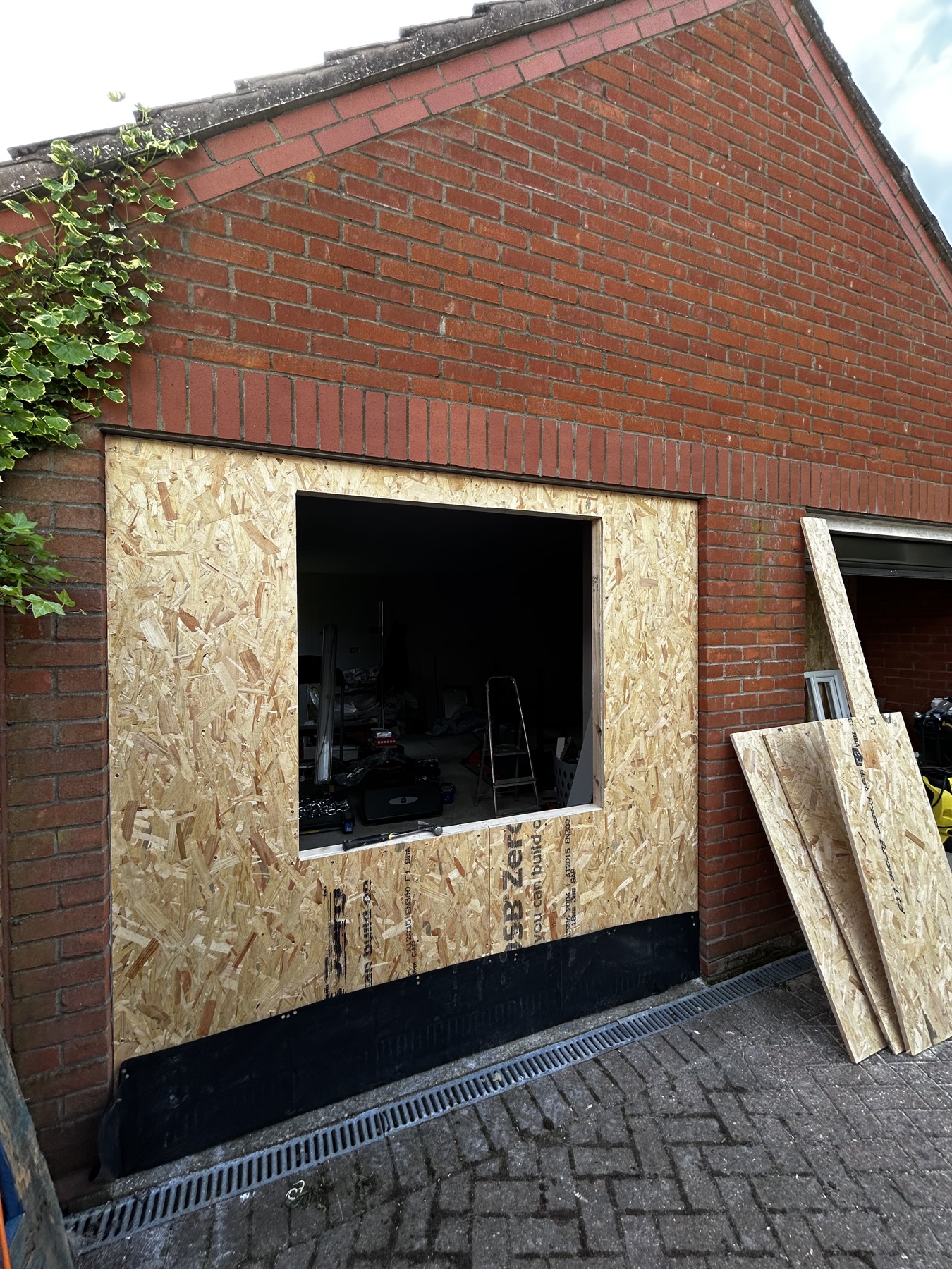 Former garage door opening framed for a new window