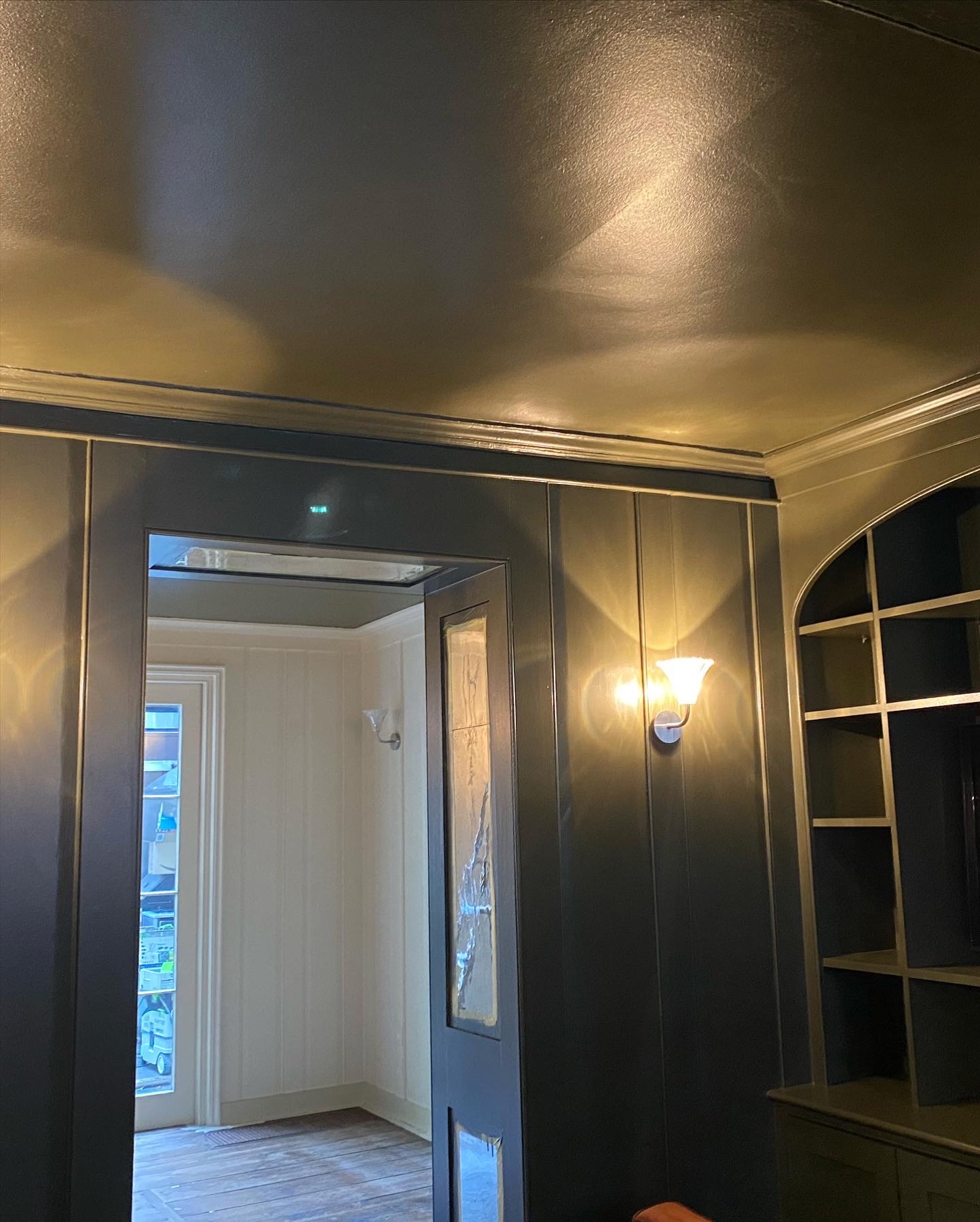 Dark painted panelled room with matching ceiling in the Tower Hamlets townhouse